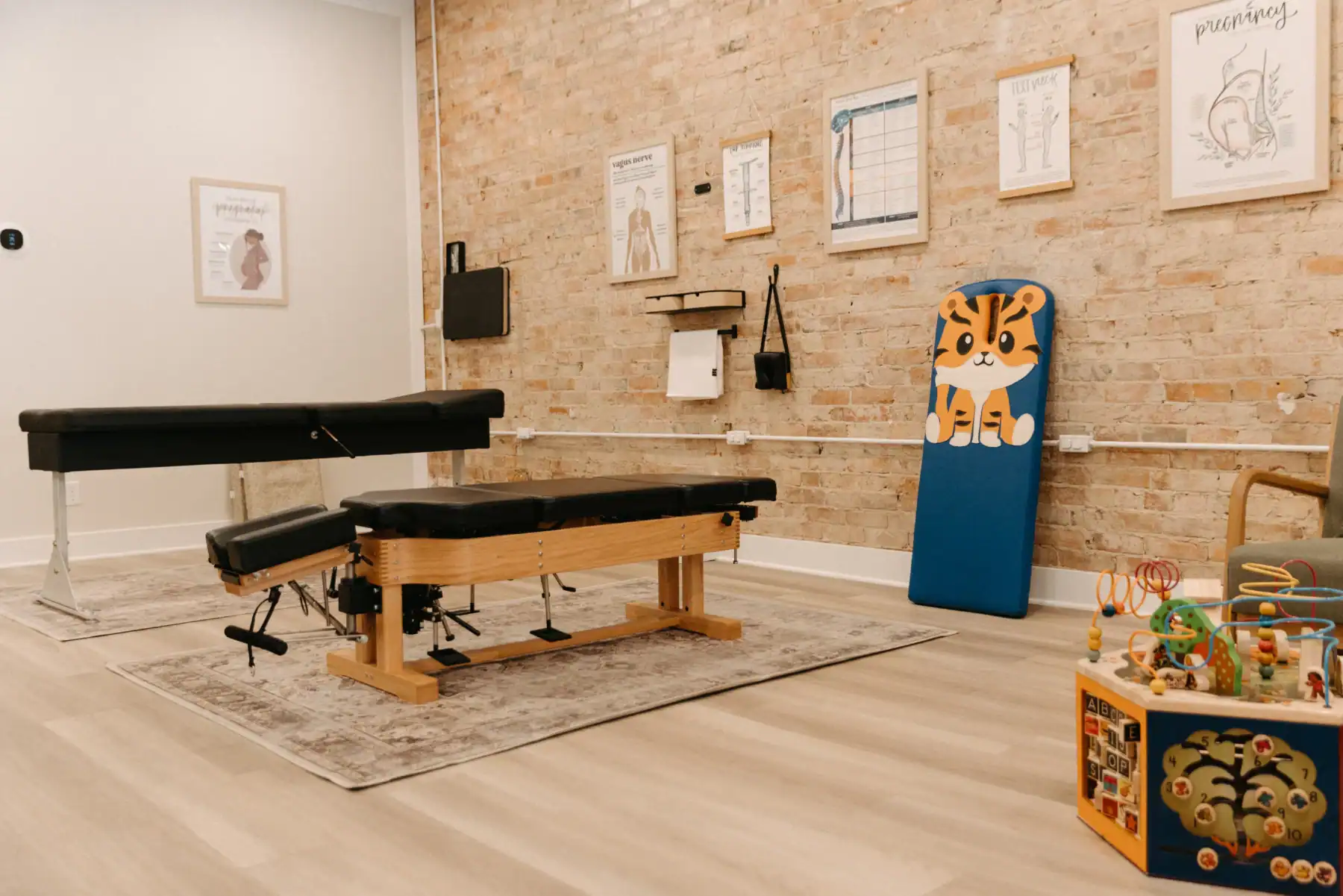 Photo of a kid's play area in a chiropractor clinic with adjustment benches
