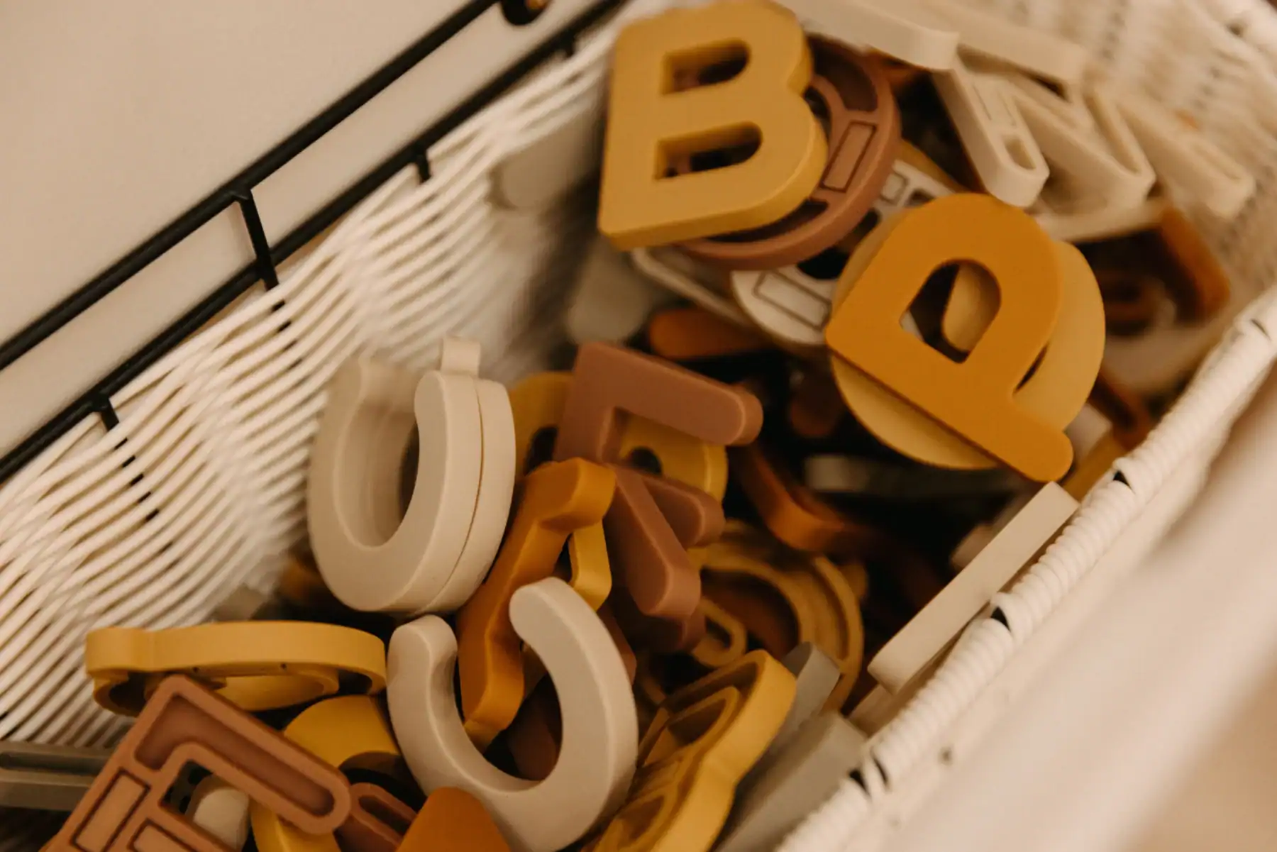 photo of a basket of alphabet letters for kids