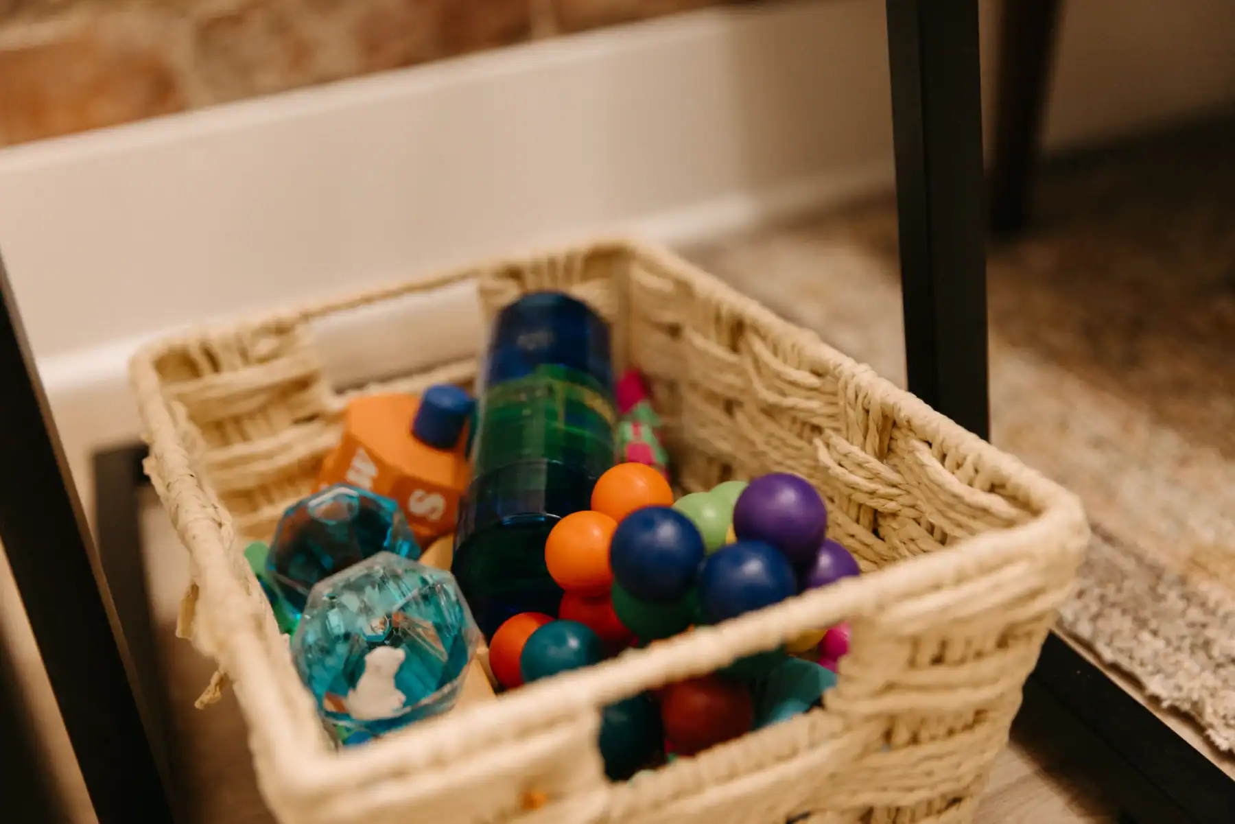 photo of a wicker basket of sensory toys for kids