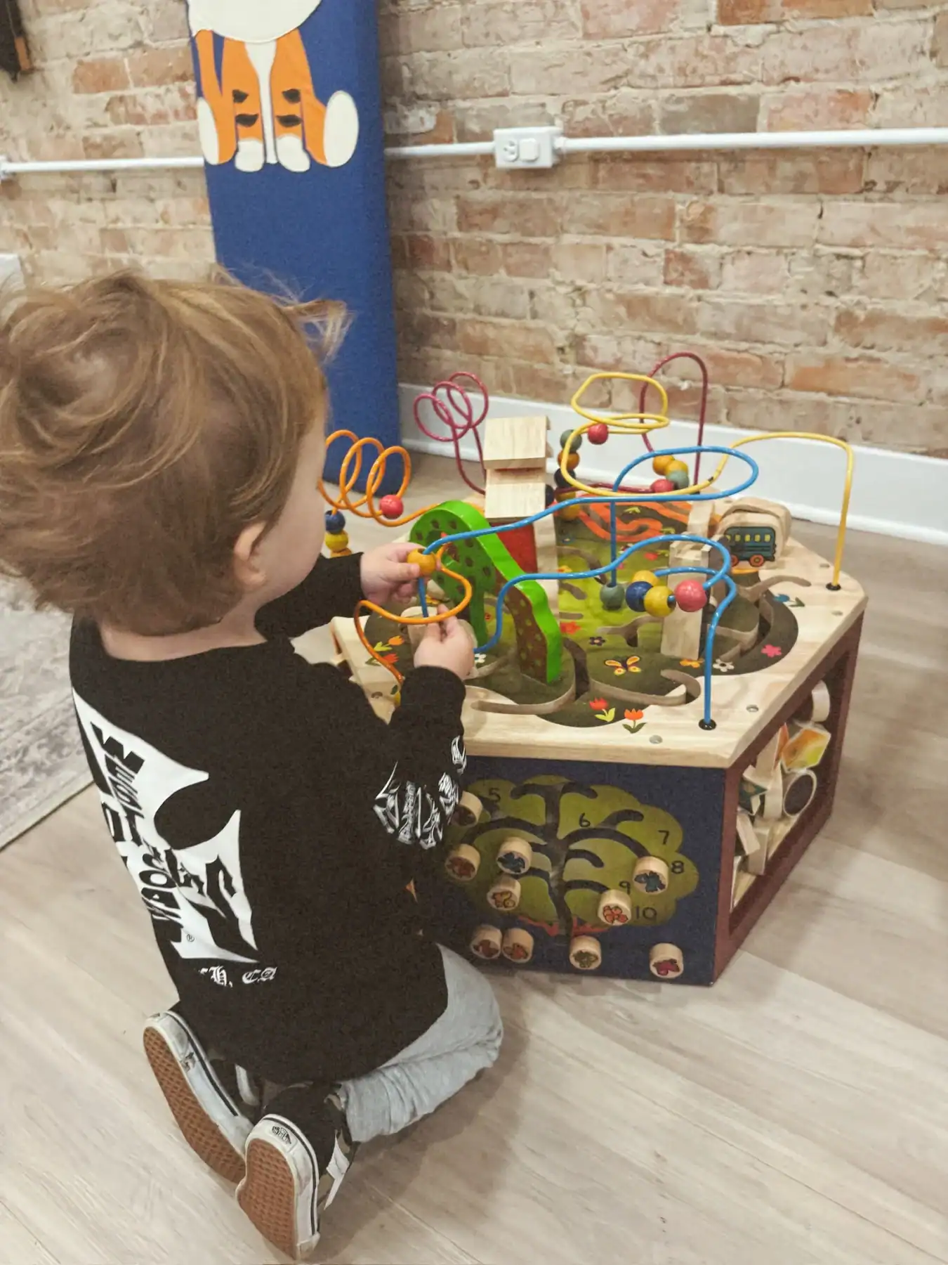 photo of a boy playing with a kid s toy in a waiting room for treating ADHD and transitions