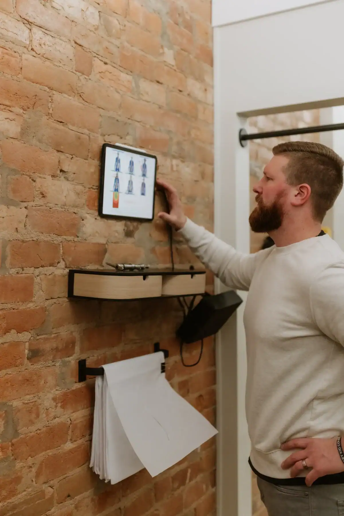 photo of Dr. Ryan working on a tablet at the Adjusted Living chiropractic office