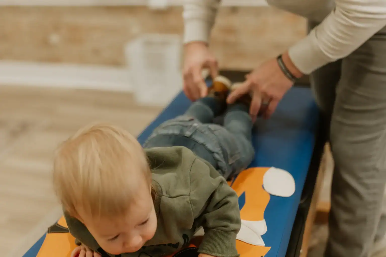 photo-of-a-chiropractor-adjusting-a-toddler-on-a-tiger-bench-for-vagus-nerve-and-digestion photo of a chiropractor adjusting a toddler on a tiger bench for vagus nerve and digestion